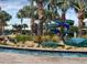 Scenic view of lush tropical landscaping and waterslides near the lazy river at 4213 Paragprah St, Kissimmee, FL 34746