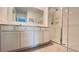Spacious bathroom with double sinks, white cabinets, and glass-enclosed shower at 4357 Babbling Brook Way, Kissimmee, FL 34746