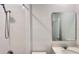 Well-lit bathroom with white tiled walls and a modern vanity with sink at 4357 Babbling Brook Way, Kissimmee, FL 34746
