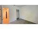 Bright bedroom featuring a carpet and a closet for storage at 4357 Babbling Brook Way, Kissimmee, FL 34746