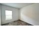Well-lit bedroom featuring carpet and a window that provides natural light at 4357 Babbling Brook Way, Kissimmee, FL 34746