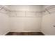 Walk-in closet with wire shelving and carpeted floor to provide storage space at 4357 Babbling Brook Way, Kissimmee, FL 34746