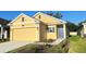 Beautiful home featuring a two car garage, complemented by well-maintained landscaping at 4357 Babbling Brook Way, Kissimmee, FL 34746