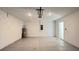 Spacious garage with concrete flooring, updated water heater, and easy access to the house at 4357 Babbling Brook Way, Kissimmee, FL 34746