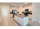 Gorgeous kitchen featuring stainless steel appliances and a large island at 4357 Babbling Brook Way, Kissimmee, FL 34746