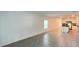 Open-concept living room with tile flooring that flows into the kitchen area at 4357 Babbling Brook Way, Kissimmee, FL 34746