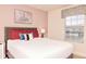 Bedroom featuring soft lighting, bed with pillows and cozy decor at 4888 Romeo Cir, Kissimmee, FL 34746