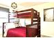 Themed bedroom with a bunk bed, pillow and cozy lighting, perfect for  at 4888 Romeo Cir, Kissimmee, FL 34746