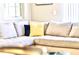 Cozy living room area with a comfortable sectional sofa and stylish accent pillows at 4888 Romeo Cir, Kissimmee, FL 34746
