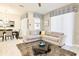 Bright and airy living room featuring a comfortable sectional sofa and stylish decor at 4888 Romeo Cir, Kissimmee, FL 34746