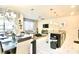 Spacious open layout of dining and living area with kitchen bar at 4888 Romeo Cir, Kissimmee, FL 34746