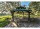 Picturesque gazebo with picnic tables, creating a perfect spot for outdoor gatherings and picnics at 5101 Staniard Dr, Kissimmee, FL 34746