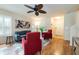 Bright living room with hardwood floors, neutral walls, and plantation shutters offer a stylish, welcoming space at 5101 Staniard Dr, Kissimmee, FL 34746