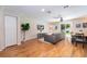 Inviting living room with wood floors, cozy seating, and sliding glass door to the outdoors at 5101 Staniard Dr, Kissimmee, FL 34746