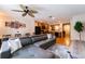 Open-concept living room flowing into kitchen, featuring hardwood floors, and comfortable sofa at 5101 Staniard Dr, Kissimmee, FL 34746