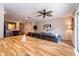 Spacious open-concept layout with kitchen, dining, and living room areas under a ceiling fan, great for entertaining at 5101 Staniard Dr, Kissimmee, FL 34746