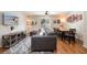 Stylish living area with a comfortable sectional sofa and an adjacent dining area creating a cohesive living space at 5101 Staniard Dr, Kissimmee, FL 34746