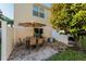Cozy patio with an outdoor table and seating with a shade umbrella at 5101 Staniard Dr, Kissimmee, FL 34746