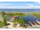 Scenic aerial view of a boat docked near boat ramps on a serene lake on a sunny day at 514 Massachusetts Ave, St Cloud, FL 34769