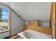 Attic space with an unfinished tub, drywall and window with views at 514 Massachusetts Ave, St Cloud, FL 34769