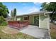 Back porch with railings, providing a relaxing outdoor space with access to the yard at 514 Massachusetts Ave, St Cloud, FL 34769