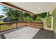 View of the back porch, spacious yard, and storage shed at 514 Massachusetts Ave, St Cloud, FL 34769