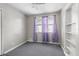 Bright bedroom featuring bare walls and floors and a built-in bookcase at 514 Massachusetts Ave, St Cloud, FL 34769