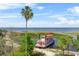 Beautiful lake view featuring a boat tour surrounded by lush greenery and a sunny sky at 514 Massachusetts Ave, St Cloud, FL 34769