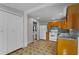 Kitchen with view to living room and white appliances at 514 Massachusetts Ave, St Cloud, FL 34769