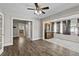 Open living area with dark hardwood floors, offering a versatile space at 514 Massachusetts Ave, St Cloud, FL 34769