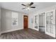 Bright living room with hardwood floors and a classic ceiling fan at 514 Massachusetts Ave, St Cloud, FL 34769