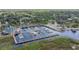 Stunning aerial view of a marina with multiple boats docked and a waterfront restaurant at 514 Massachusetts Ave, St Cloud, FL 34769