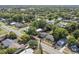 Overhead shot showcasing this home nestled in a tranquil neighborhood surrounded by trees at 514 Massachusetts Ave, St Cloud, FL 34769