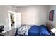 Bedroom with a view of an adjacent room, decorated with modern furniture and minimalist design at 5560 Metrowest Nw Blvd # 106, Orlando, FL 32811