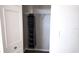 Narrow closet design with a multi-tiered shoe organizer and a minimal amount of shelving at 5560 Metrowest Nw Blvd # 106, Orlando, FL 32811