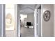 Interior doorway view of the bathroom, living area and dining room in neutral colors at 5560 Metrowest Nw Blvd # 106, Orlando, FL 32811