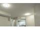 Living space features a ceiling with modern lighting and an opening to the kitchen at 5560 Metrowest Nw Blvd # 106, Orlando, FL 32811