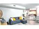 Spacious living room with comfortable seating and open layout to the kitchen area at 5560 Metrowest Nw Blvd # 106, Orlando, FL 32811