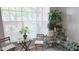 Bright sitting area with large windows and an array of houseplants at 5560 Metrowest Nw Blvd # 106, Orlando, FL 32811