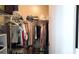 Walk-in closet features hanging racks, shelves and ample room for storage at 5560 Metrowest Nw Blvd # 106, Orlando, FL 32811