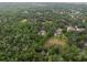 Aerial view of a home with pool in a heavily wooded area at 6340 Nelms E Rd, Lakeland, FL 33811