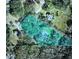 Aerial view of the property with a beautiful pool and lush surrounding landscape at 6340 Nelms E Rd, Lakeland, FL 33811