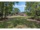 Large backyard with an enclosed pool area, perfect for outdoor entertaining at 6340 Nelms E Rd, Lakeland, FL 33811