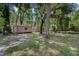 The backyard features a fire pit and two storage sheds for convenience at 6340 Nelms E Rd, Lakeland, FL 33811