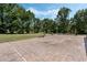 Lush backyard featuring an expansive stone paver patio with ample space for outdoor enjoyment at 6340 Nelms E Rd, Lakeland, FL 33811