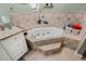 Bathroom features a large soaking tub with tiled walls and a granite-topped vanity at 6340 Nelms E Rd, Lakeland, FL 33811