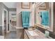 Cozy bathroom with granite countertop, large mirror, and a soft blue towel, creating a relaxing atmosphere at 6340 Nelms E Rd, Lakeland, FL 33811