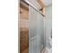 Bathroom showcasing tiled shower and a sliding frosted shower door at 6340 Nelms E Rd, Lakeland, FL 33811