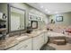 Spacious primary bathroom with double sinks, granite countertops, and a large soaking tub at 6340 Nelms E Rd, Lakeland, FL 33811