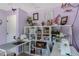 Craft room featuring a white shelving unit, a sewing machine, and a cozy crafting atmosphere at 6340 Nelms E Rd, Lakeland, FL 33811